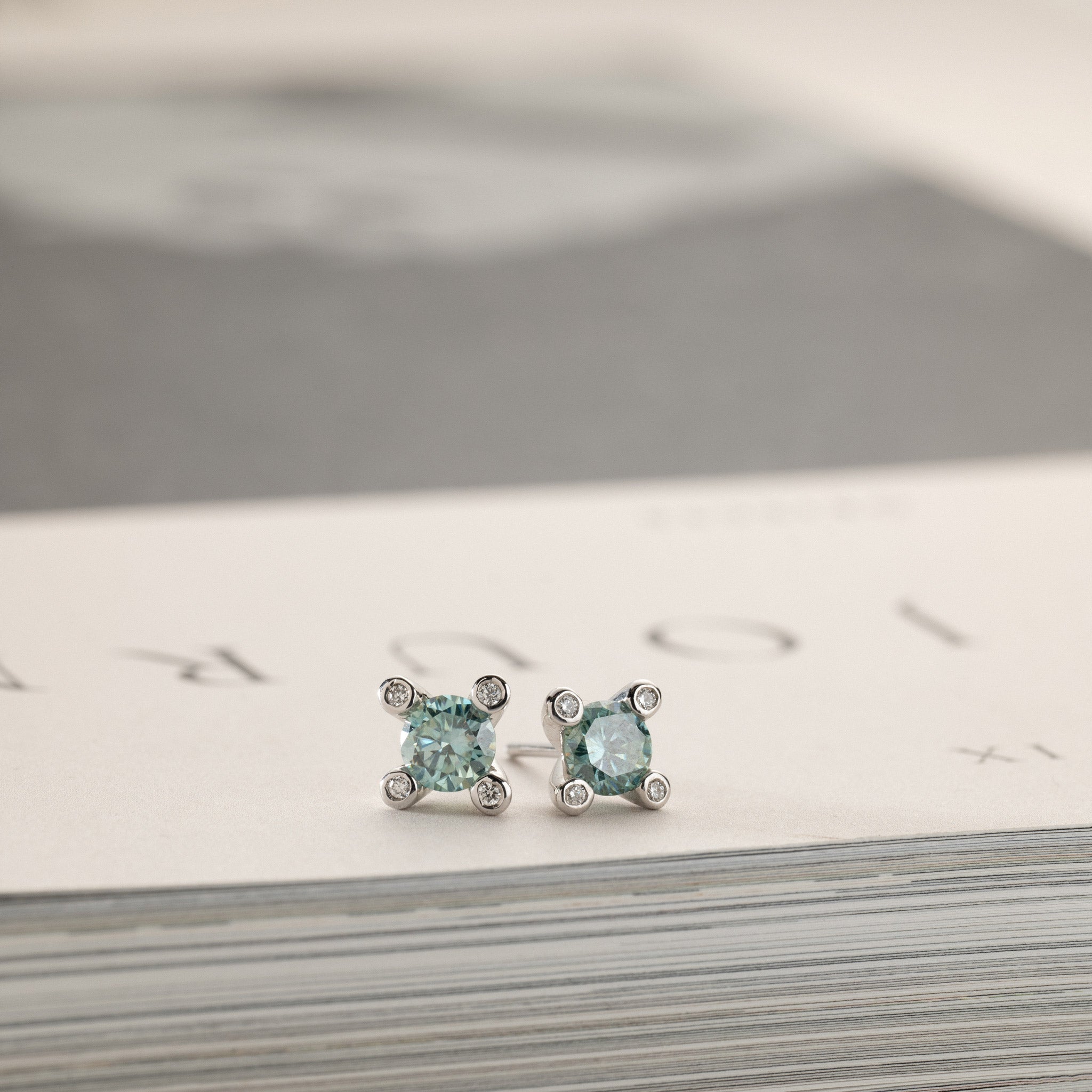 Miriam – solitaire stud earrings 2x0.50ct Laguna green moissanite & diamonds in crown silver