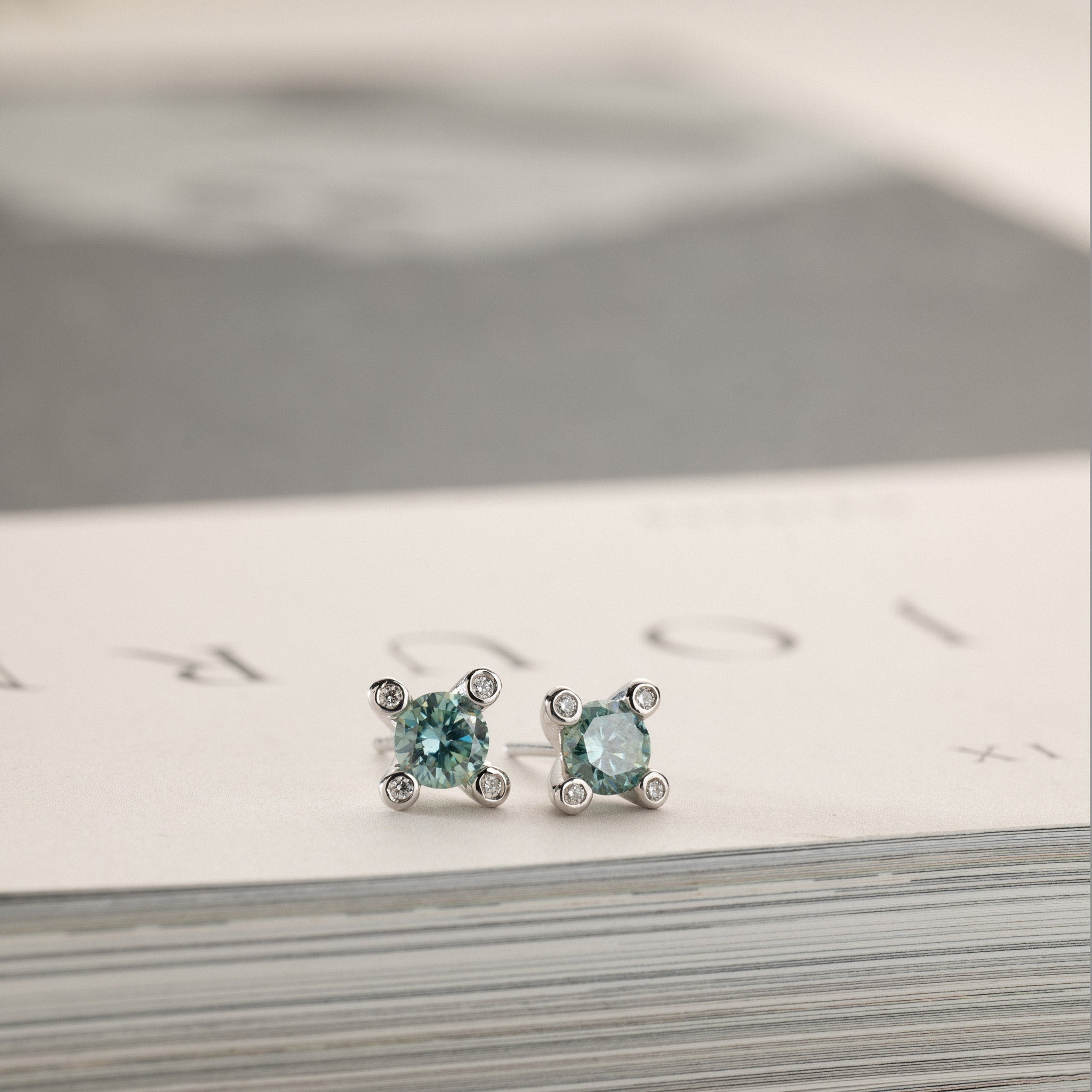 Miriam – solitaire stud earrings 2x0.50ct Laguna green moissanite & diamonds in crown silver