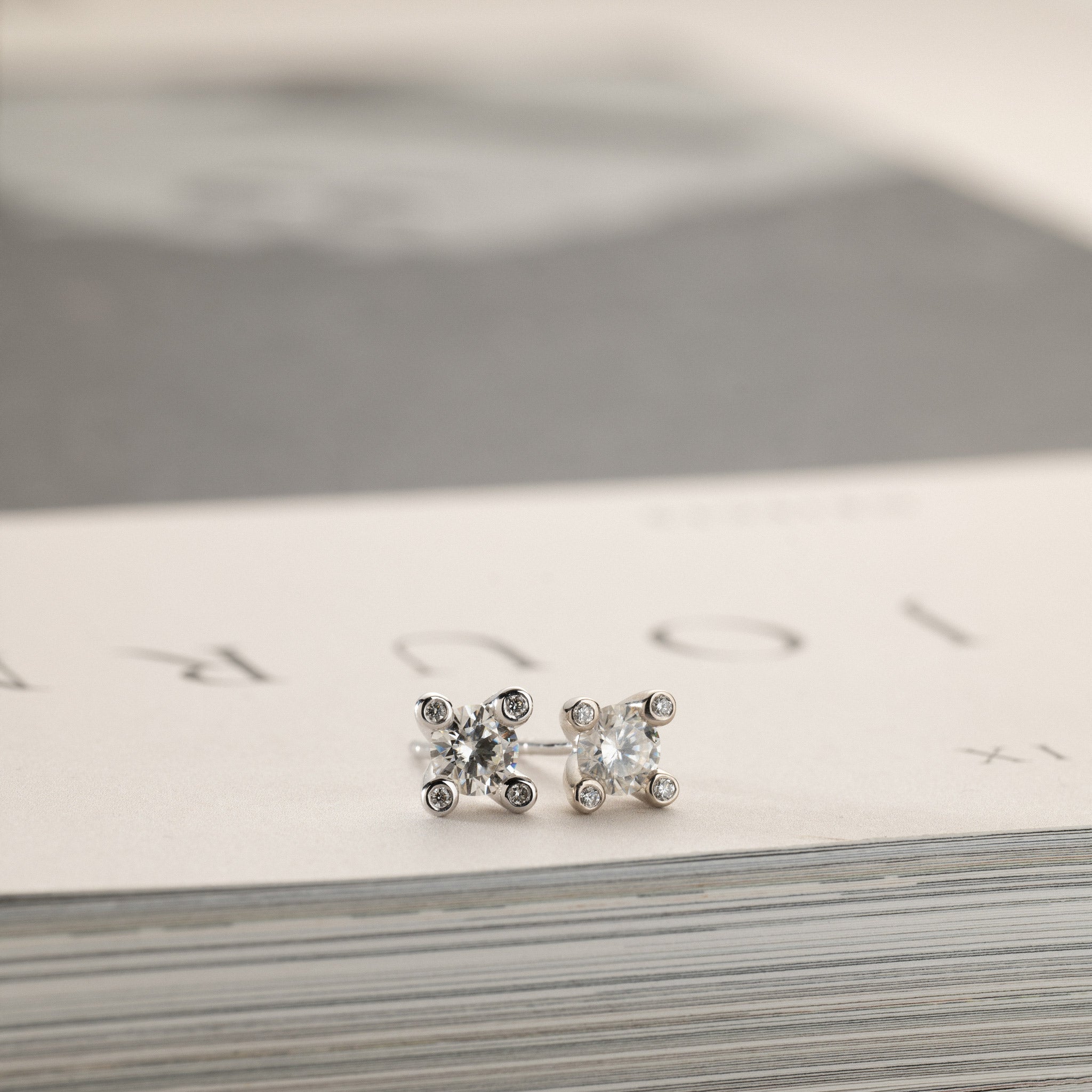Miriam – solitaire stud earrings 2x0.50ct Moissanite & diamonds in crown silver