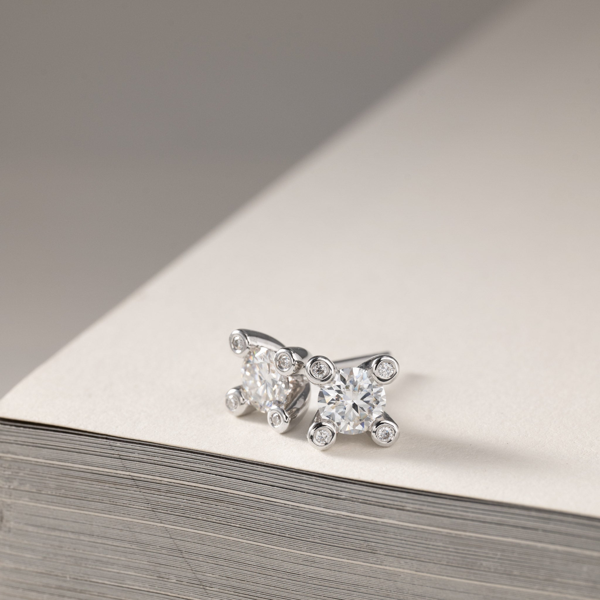 Miriam – solitaire stud earrings 2x0.50ct Moissanite & diamonds in crown silver