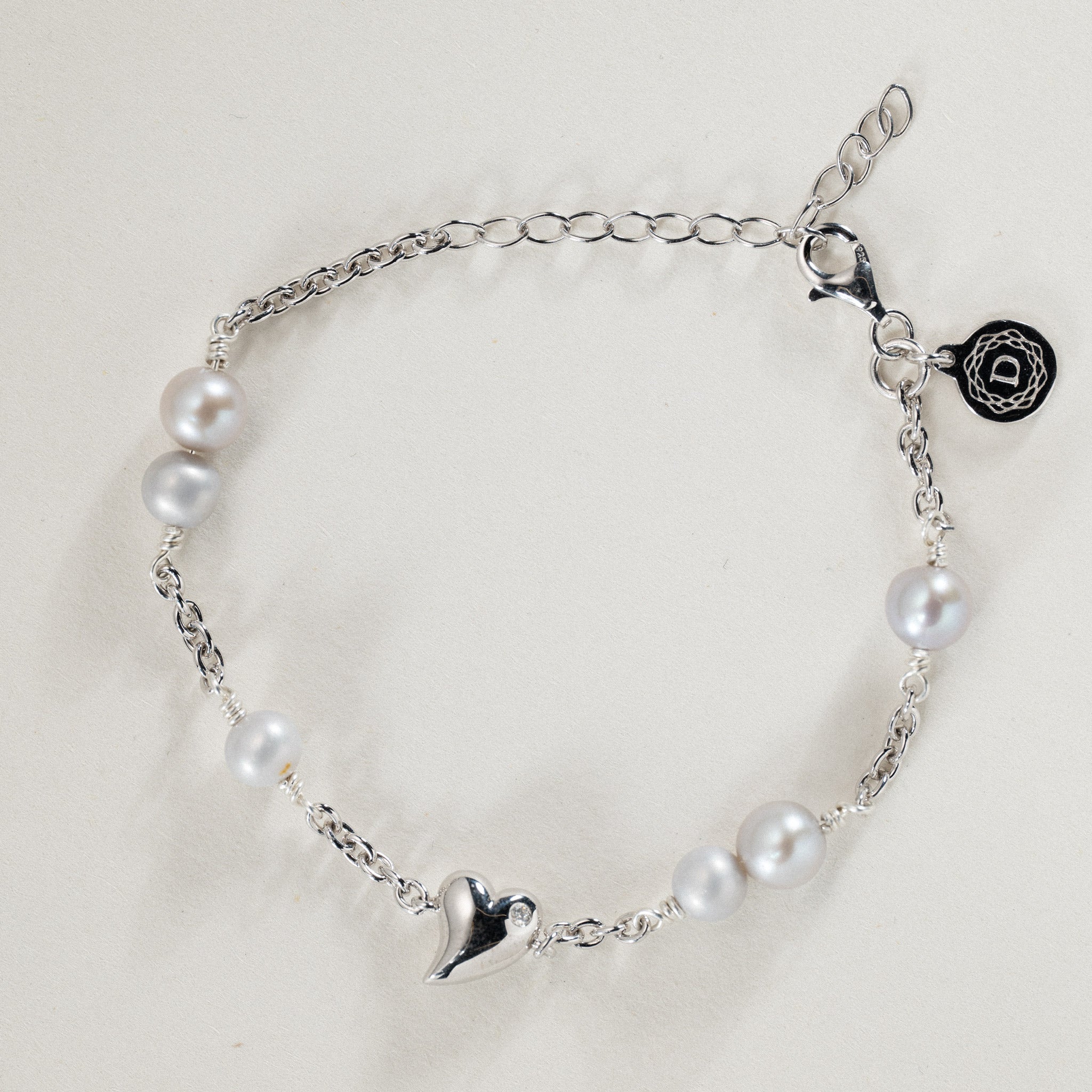 No. 11 - 0.02ct Grown Diamond Twisted heart bracelet in silver w. freshwater pearls