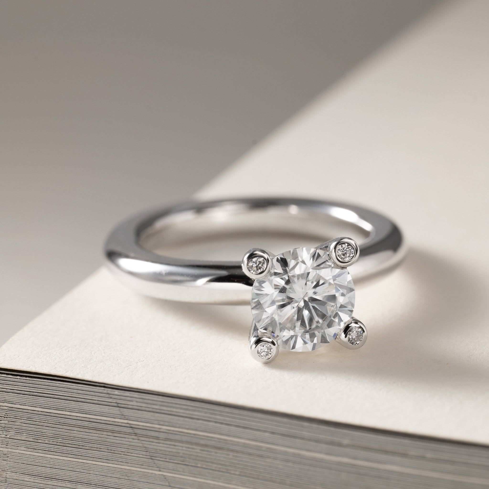 Miriam solitaire ring 0.75ct Moissanite & diamonds in crown silver with texture